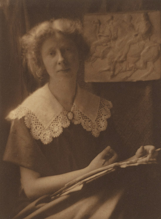 portrait of a young imogen cunningham, seated next to the elgin mables
